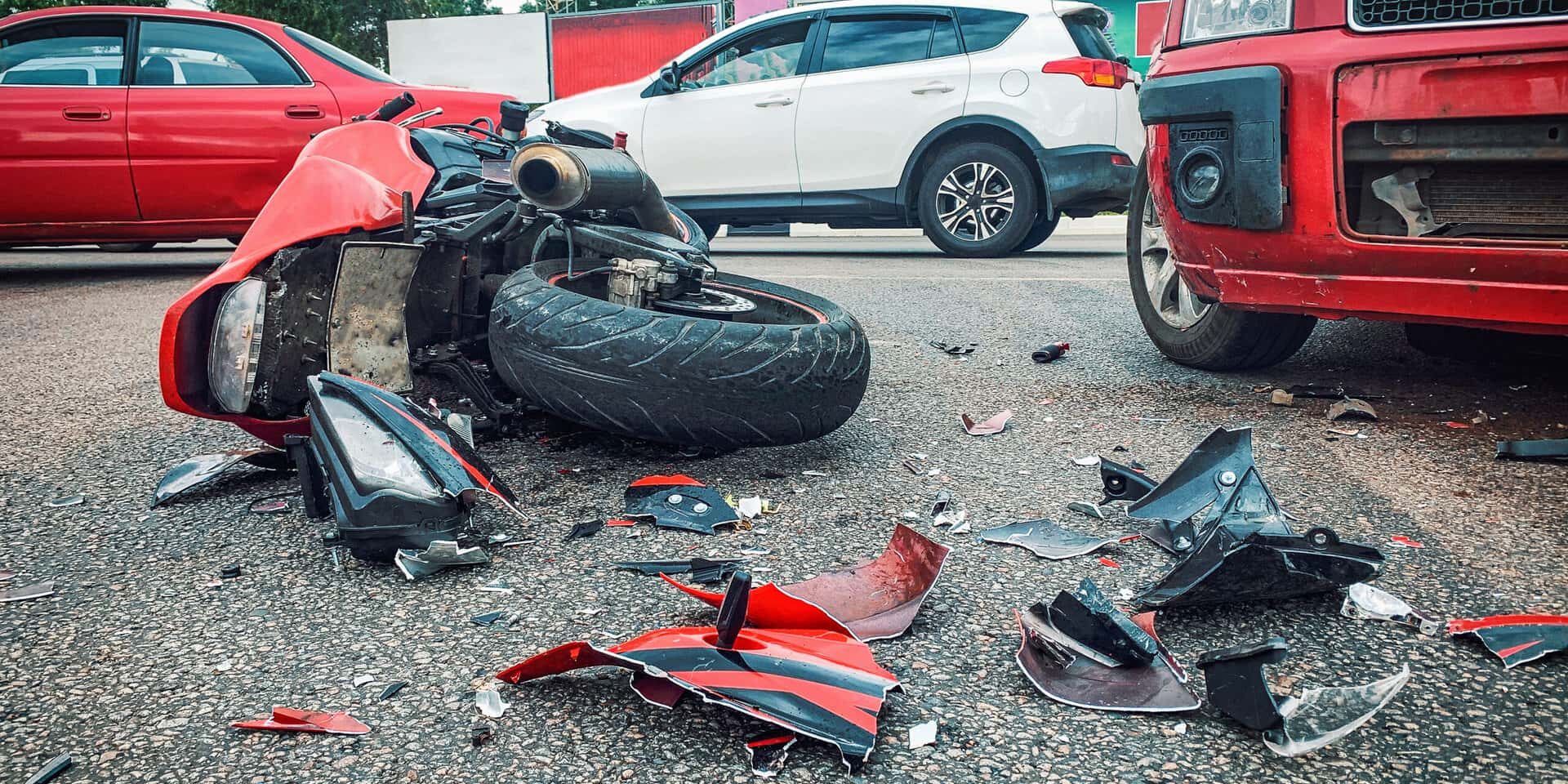 Motorcycle bike accident and car crash, broken and wrecked moto